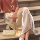 Upgrade Your Wardrobe with Our Spring and Autumn Half Length Pleated Skirt - Featuring Pearlescent Fabric and Elegant Pleats!